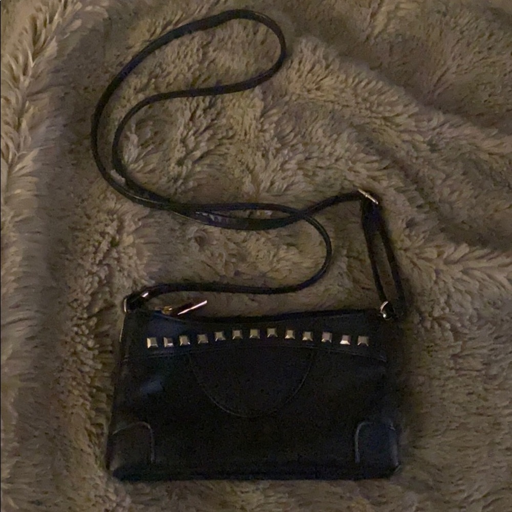 Faux leather studded cross body purse.